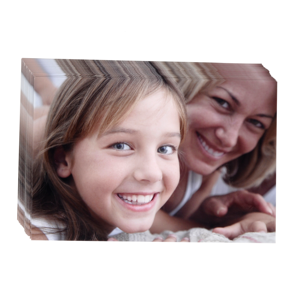 A woman and a little girl are smiling in front of a printed canvas on Fuji Personalized Photo Products Small Format Prints.