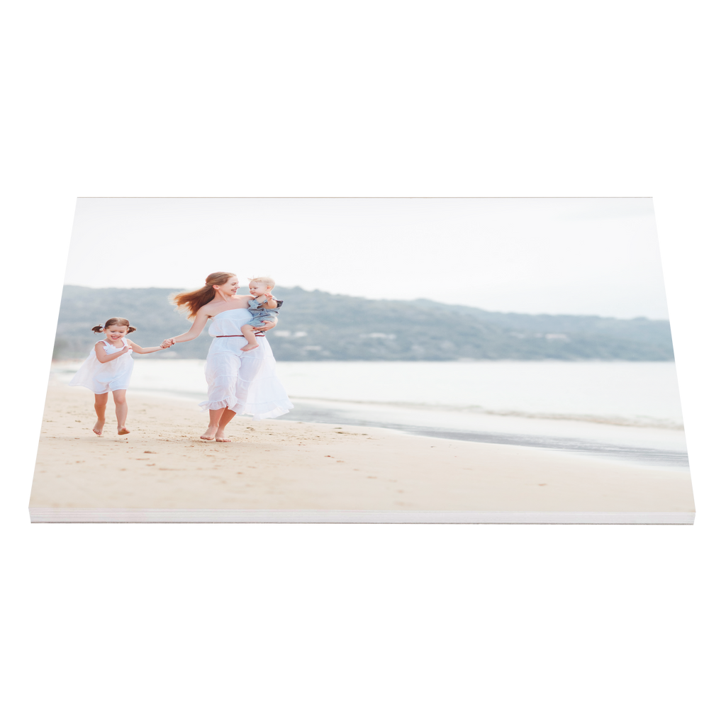 A photo of a family walking on the beach, captured in a personalized Fuji Personalized Photo Products Notepad Planner.