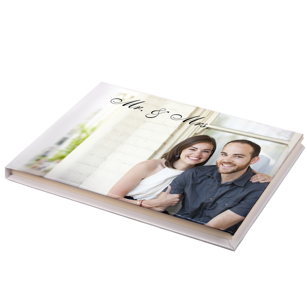 A Guest Registry Book from Fuji Personalized Photo Products with a man and a woman celebrating their wedding memories.