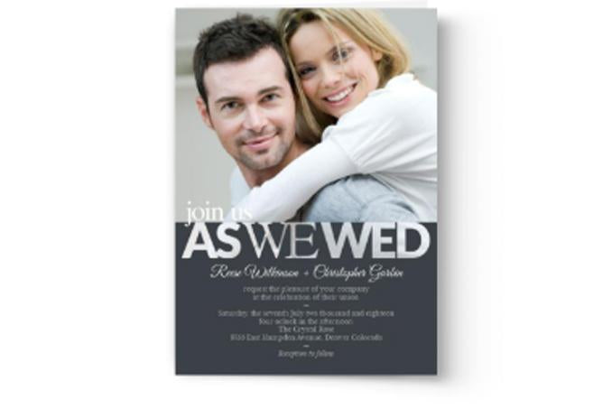 A Photo Book Press custom printed wedding invitation with a photo of a man and a woman.