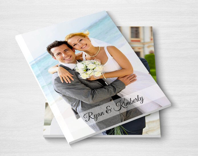 A personalized wedding album with a photo of a bride and groom, bound in hardcover from Photo Book Press's Make & Print Hardcover Photobooks.