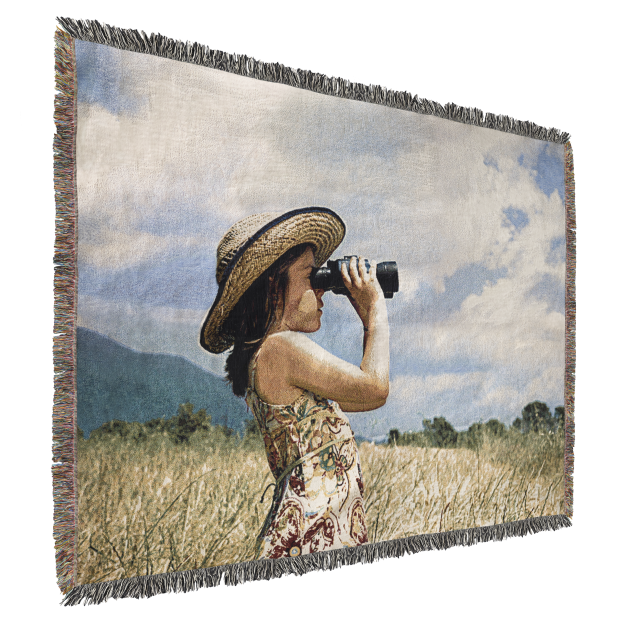 A girl in a straw hat looking through binoculars on a Fuji Personalized Photo Products Woven Throw Blanket.