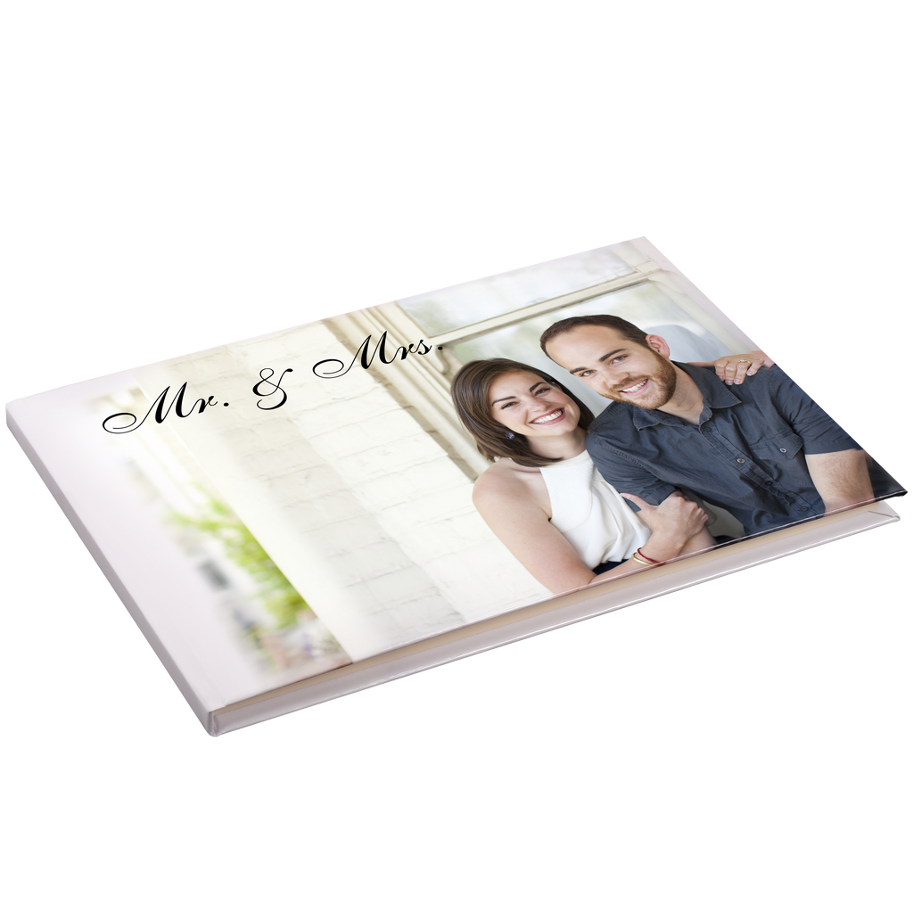 A Fuji Personalized Photo Products Guest Registry Book with a couple's photo on it, perfect for preserving special occasion memories.