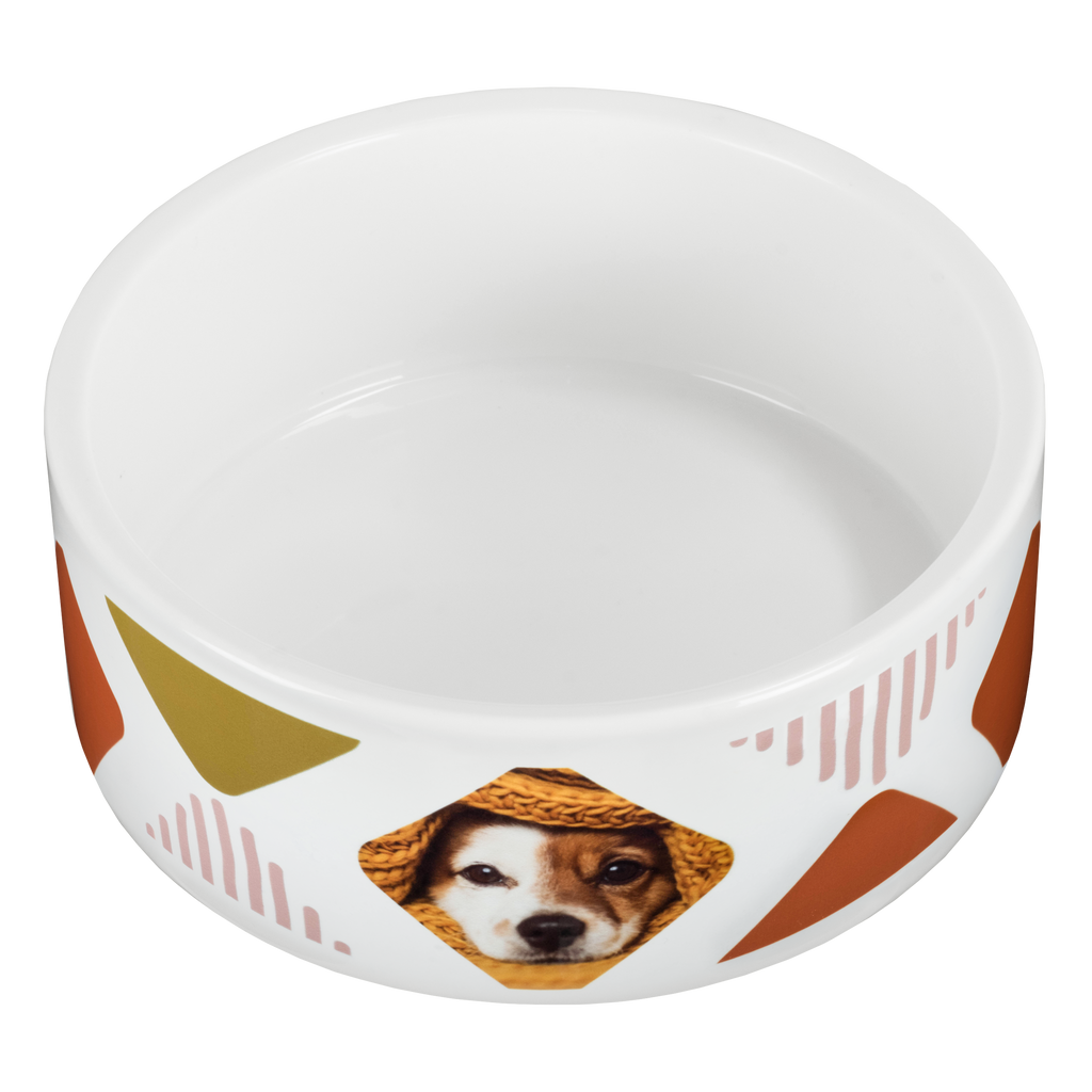 A personalized white ceramic pet bowl from Fuji Personalized Photo Products with a photo of a small dog on it.