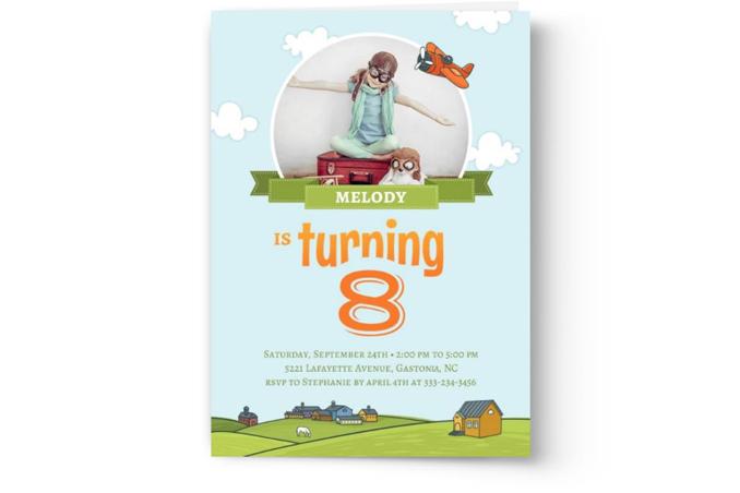 A birthday invitation card for Melody's 8th birthday featuring a template design illustration of a girl sitting on a suitcase with a toy airplane flying overhead from Photo Book Press' Create & Print Kid's Photo Birthday Party Invitations.