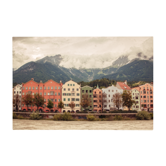 Vibrant colorful buildings in a city with mountains in the background, depicted on Fuji Personalized Photo Products' durable Metal Prints.
