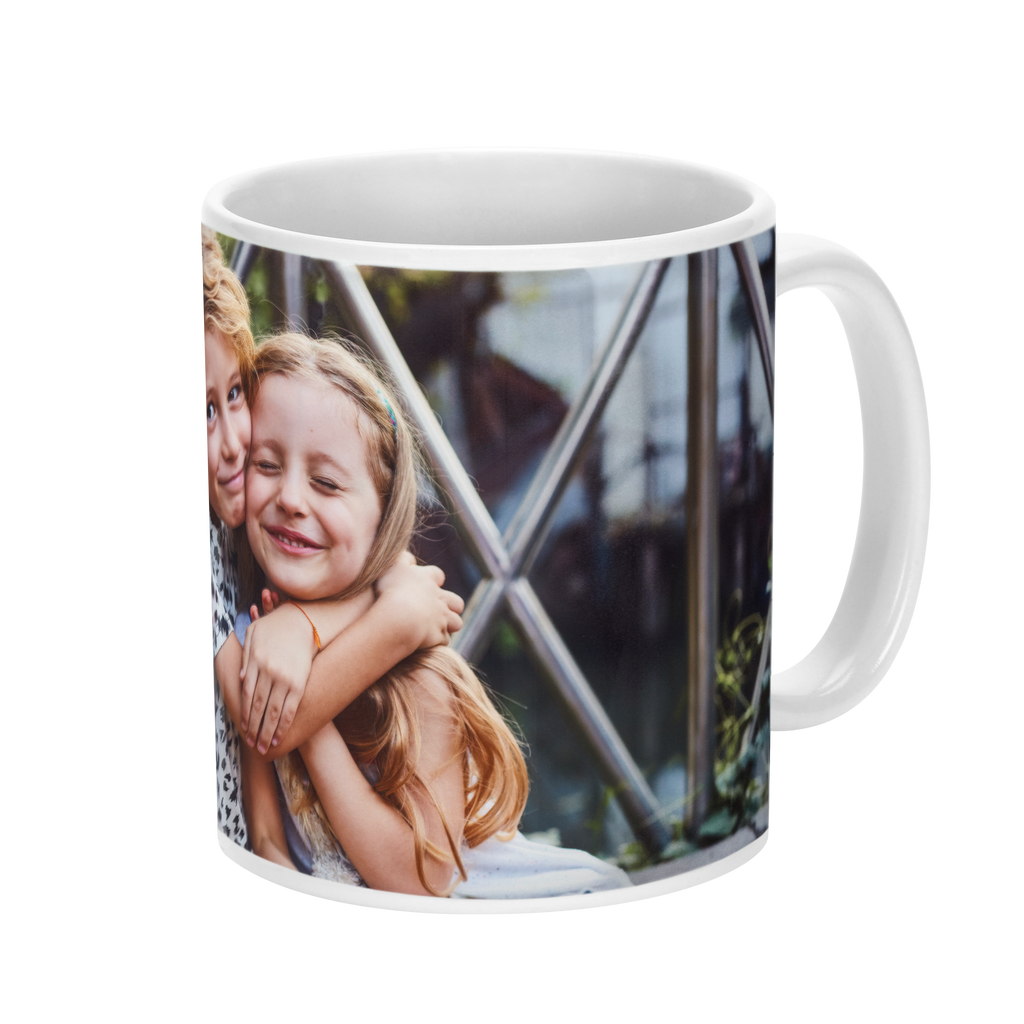 Two children hugging each other on a Fuji Personalized Photo Products Solid Ceramic Photo Mug.