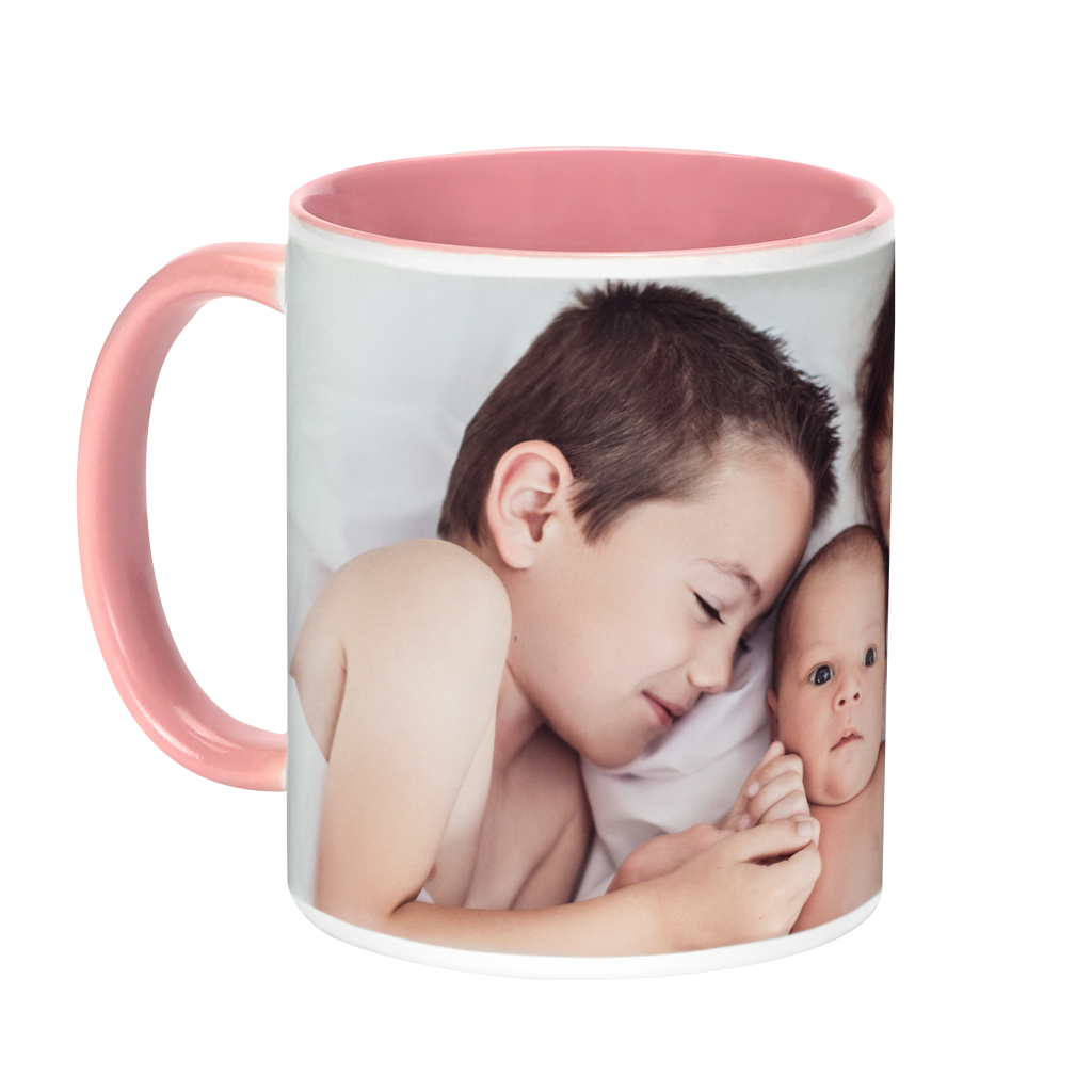 A pink Colorful Ceramic Photo Mug from Fuji Personalized Photo Products with a photo of a child and a baby, featuring a colorful handle.