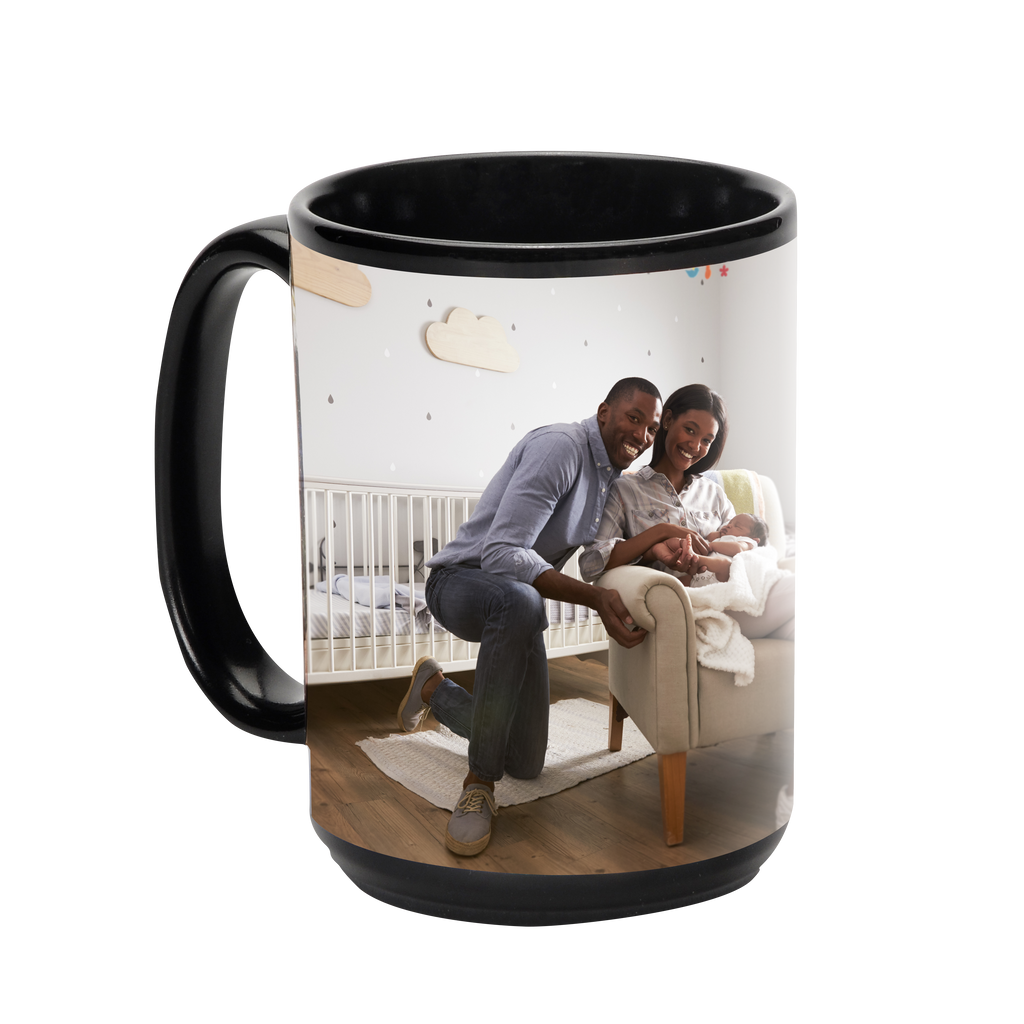 A black Solid Ceramic Photo Mug from Fuji Personalized Photo Products with a couple holding a baby in a crib, microwave safe and dishwasher safe.
