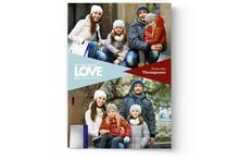 A Photo Book Press personalized Valentine's Day card of a family sitting on the sidewalk.