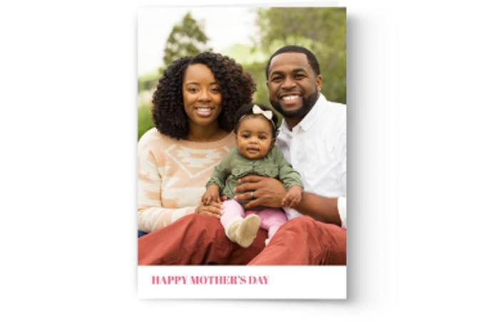 Family with an infant celebrating Mother's Day with a Photo Book Press custom-printed card.