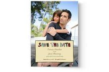 A custom printed Photo Book Press save the date card featuring a man and a woman hugging.