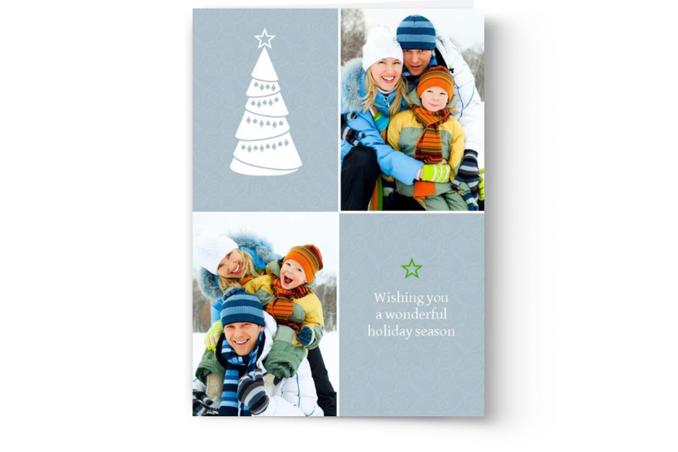 A personalized Custom Christmas Card Printing with a photo of a family and a tree by Photo Book Press.